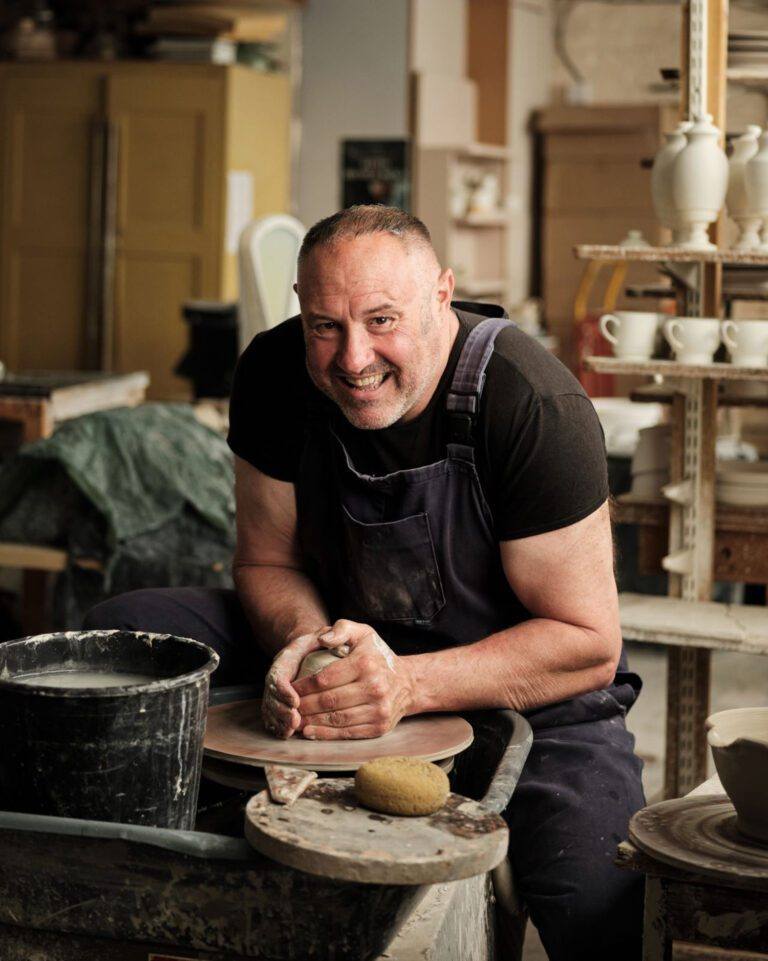 Keith Brymer Jones sat down doing pottery.