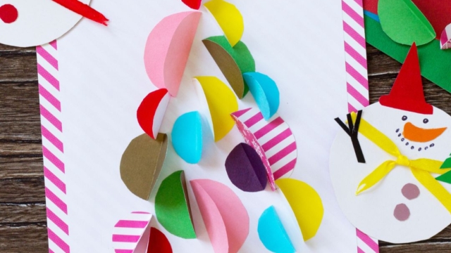 A colourful rainbow Christmas tree on a handmade Christmas card.