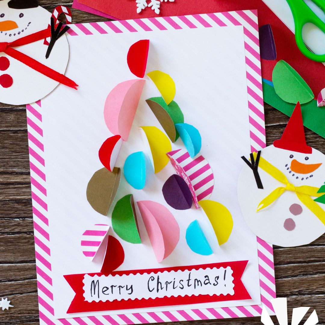 A colourful rainbow Christmas tree on a handmade Christmas card.