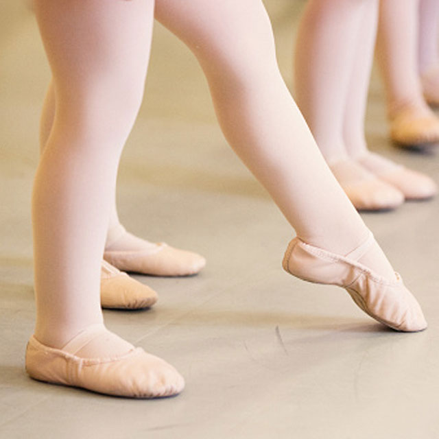 A close up of ballet shoes.