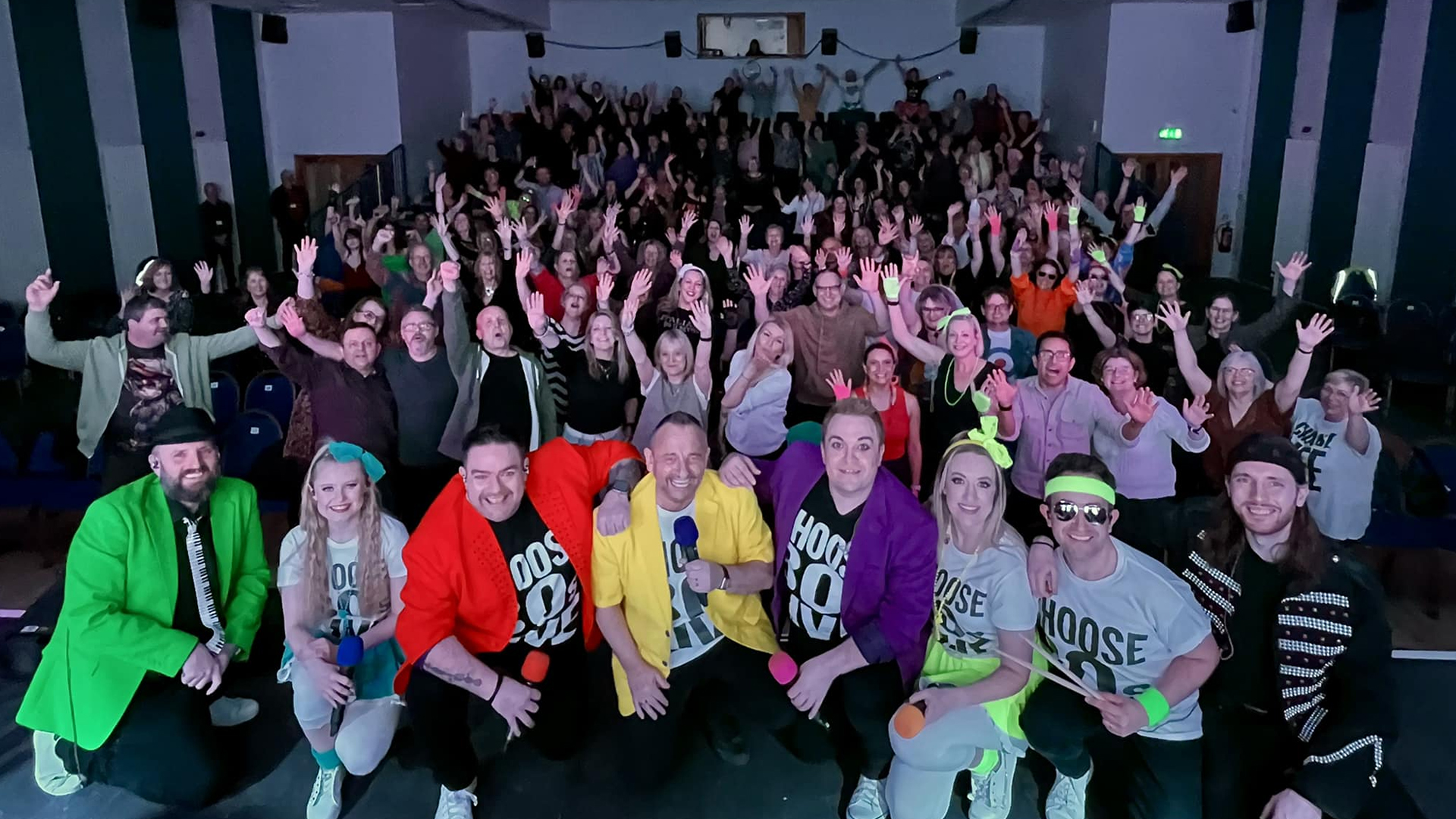 The performers and audience for 80s live.
