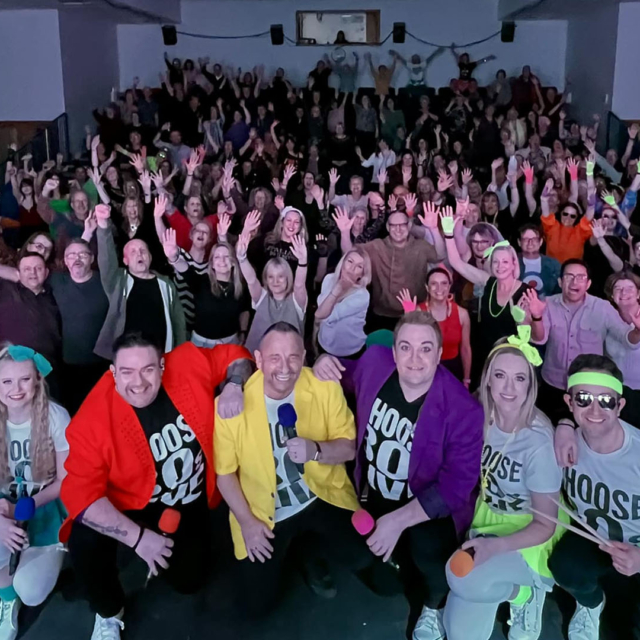 The performers and audience for 80s live.