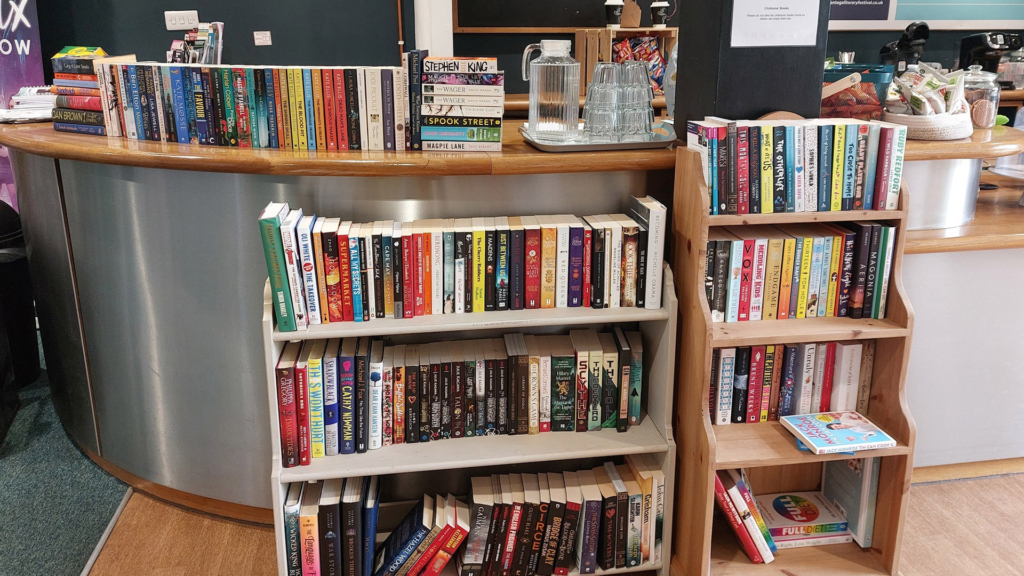 Wooden shelves full of books.