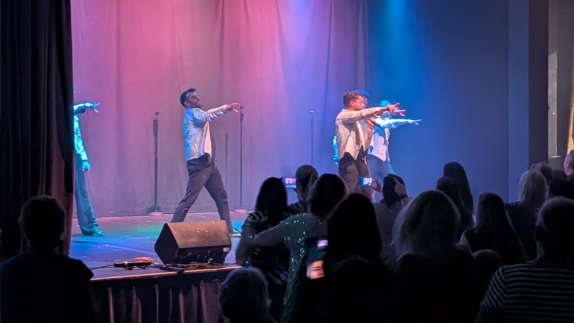 A group of people performing on stage.