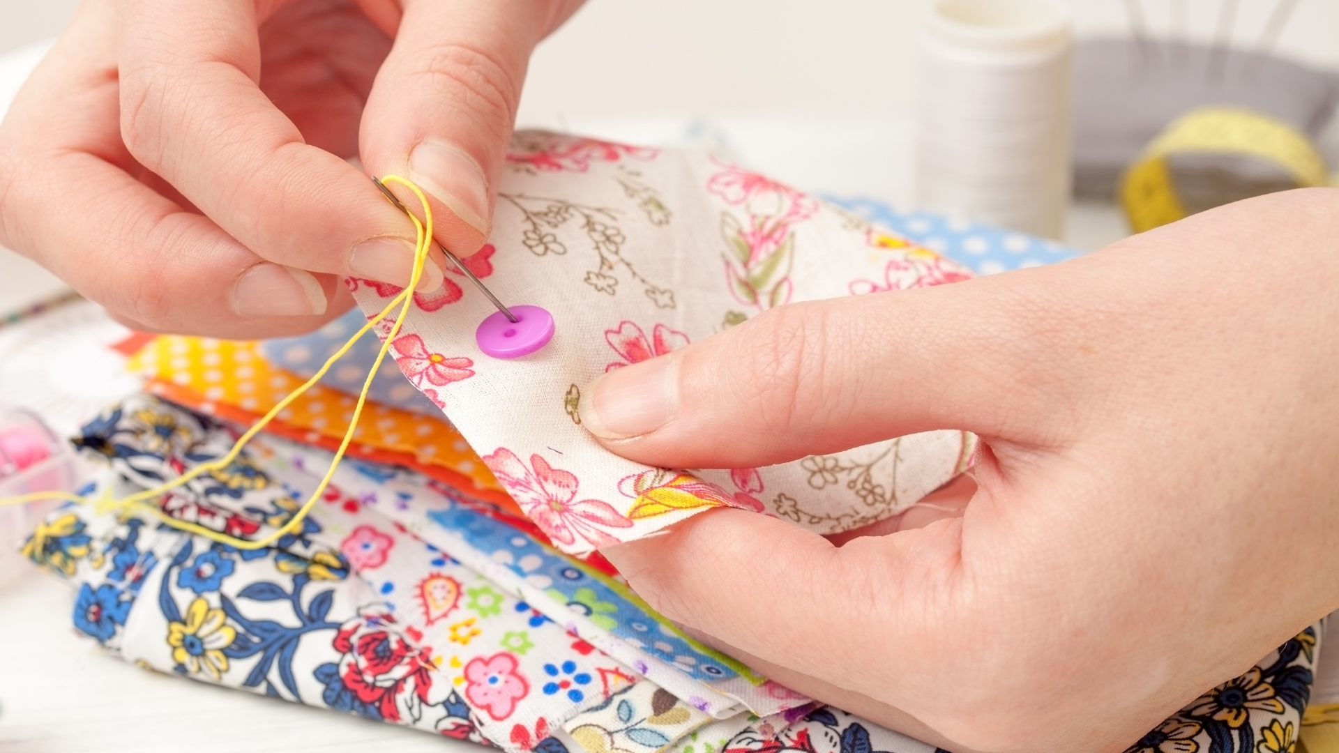 picture of hands, hand stitching fabric